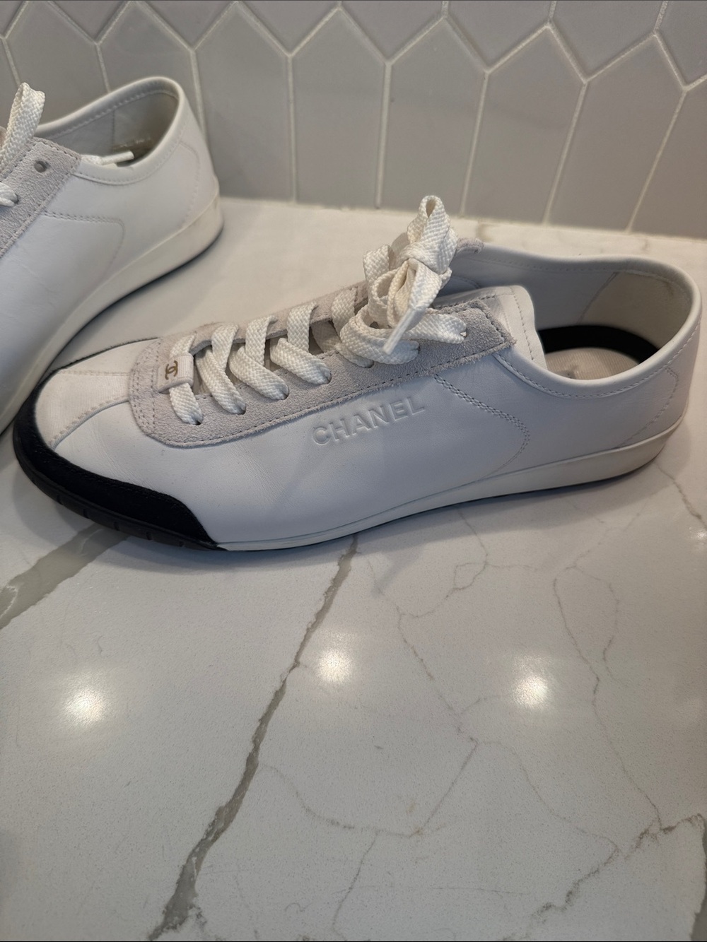 CHANEL White Leather Low-Top Sneaker with Black Toe Cap worn one time size 40